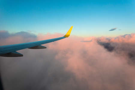 Stunning sunset from the window of the aircraft during the flight.の写真素材