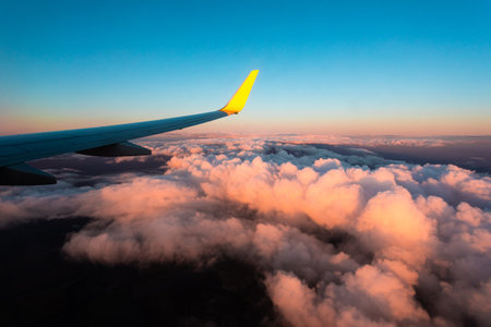 Stunning sunset from the window of the aircraft during the flight.の写真素材