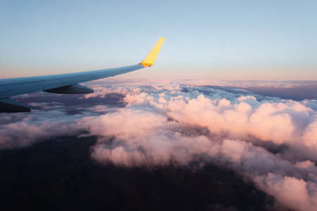 Stunning sunset from the window of the aircraft during the flight.の写真素材