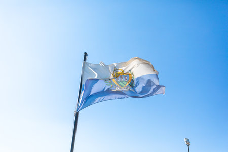 Flag of San Marino in front of blue skyの写真素材