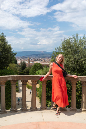 Woman stands against the backdrop of the panorama of Florence, Italy.の写真素材