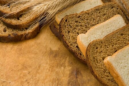 tasty set of bun and bread on wood texture
