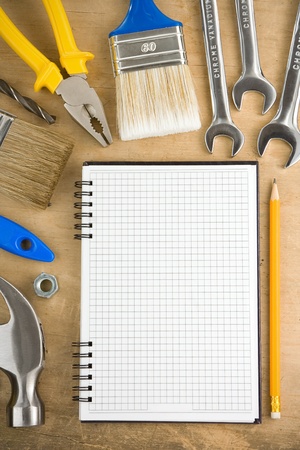 tools and pad on wood textureの写真素材