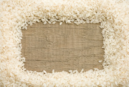 rice grain on wood background textureの写真素材