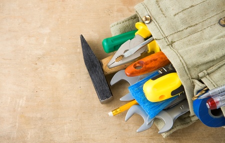tools construction and bag on wood texture