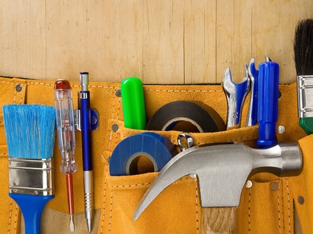 tools in belt on wooden textureの写真素材