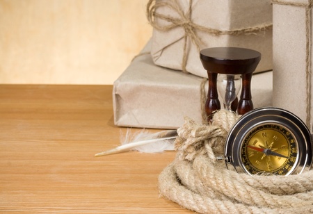 parcel wrapped with brown paper tied with rope  on wood backgroundの写真素材