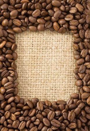 coffee beans on sack burlap backgroundの写真素材