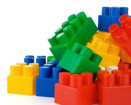 colorful plastic toys and bricks isolated on white backgroundの写真素材