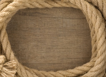 ship ropes and knot on wood background textureの写真素材