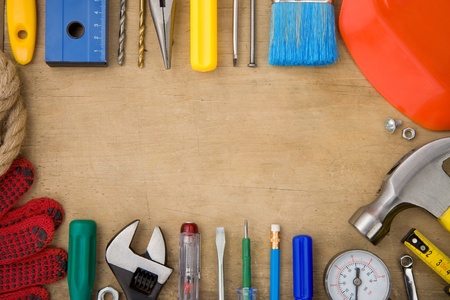 set of tools on wood background texture