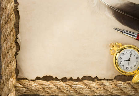 ropes and compass on old vintage ancient paper background texture
