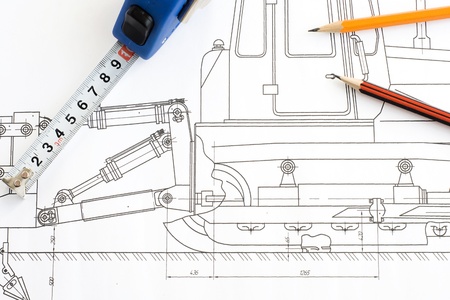 tape measure and pencil at drawing