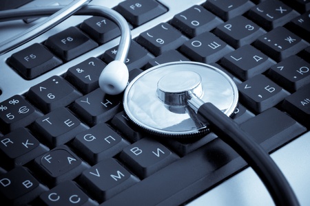 isolated stethoscope at keyboard backgroundの写真素材
