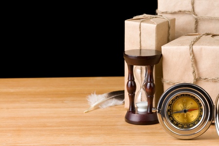 parcel wrapped packaged box isolated on black backgroundの写真素材