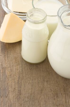 milk products and cheese on wooden backgroundの写真素材