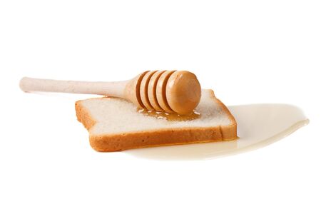 bread and honey on whiteの写真素材