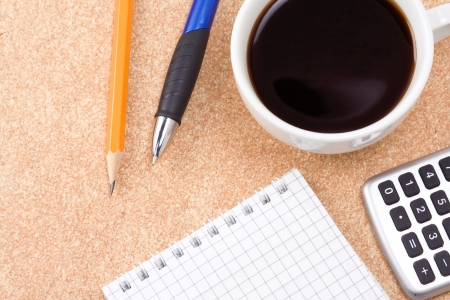 binder pad, pens and coffee on tableの写真素材
