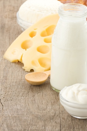 milk products cheese on wooden backgroundの写真素材