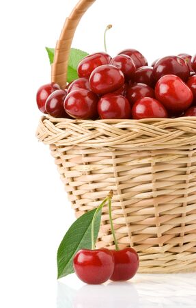 sweet cherry in basket isolated on white backgroundの写真素材