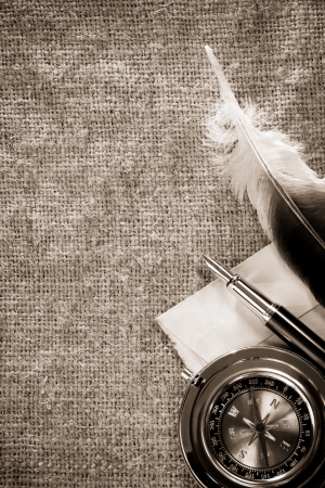 compass and ink pen on old vintage sack background textureの写真素材