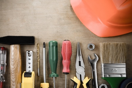 kit of construction tools and instruments on wood texture backgroundの写真素材