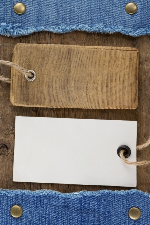 blue jean and price tag on wood texture backgroundの写真素材