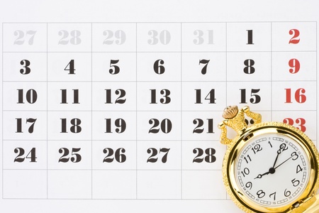pocket watch on calendar backgroundの写真素材