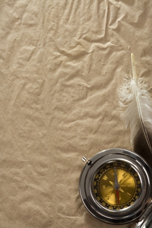 ropes and compass on old vintage ancient paper background textureの写真素材