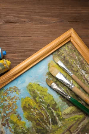 brush and painting  on wood backgroundの写真素材