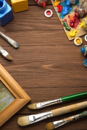 brush and painting  on wood backgroundの写真素材