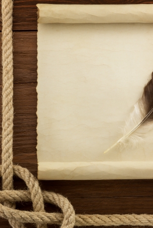 ropes and old vintage ancient paper at wood backgroundの写真素材