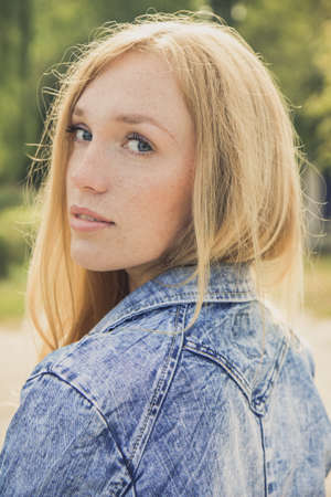 beautiful young woman portrait outdoorsの写真素材