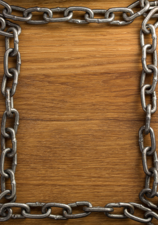 metal chain on wooden backgroundの写真素材