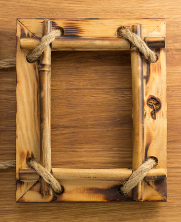 photo frame on wooden backgroundの写真素材