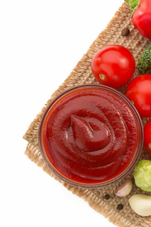 tomato sauce in bowl isolated on white backgroundの写真素材