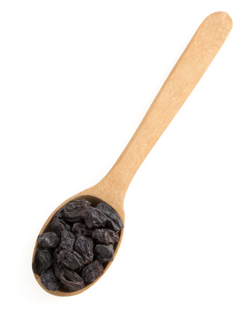 raisins fruit in spoon on white backgroundの写真素材