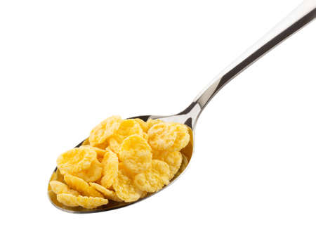 corn flakes in spoon isolated on white backgroundの写真素材