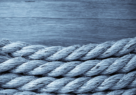 ship ropes on wooden backgroundの写真素材