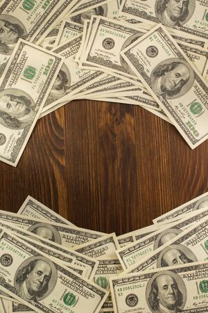 dollars money banknotes on wooden backgroundの写真素材