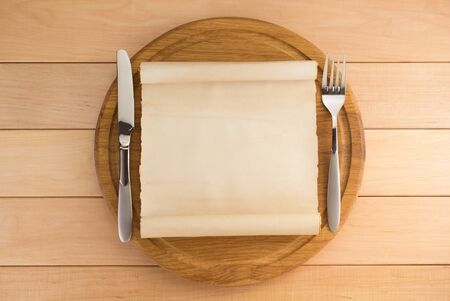 kitchen utensils at cutting board on wooden backgroundの写真素材