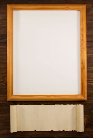 photo picture frame on wooden backgroundの写真素材