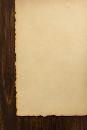 paper parchment on wooden backgroundの写真素材