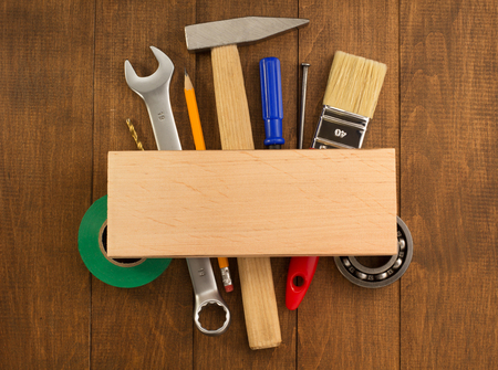 set of tools and instruments on wooden background