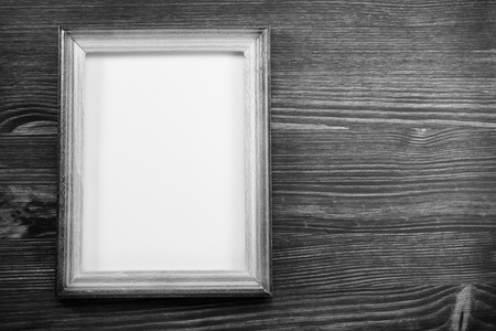 photo picture frame on wooden backgroundの写真素材