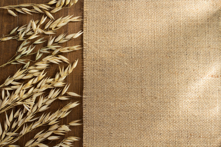 ears of oat on wooden backgroundの写真素材