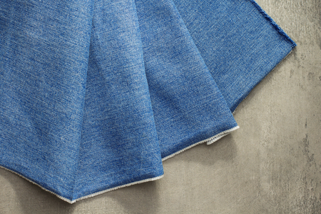 blue jeans texture on wooden backgroundの写真素材