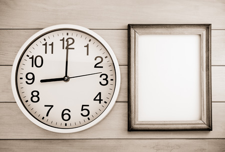 wall clock on wooden backgroundの写真素材