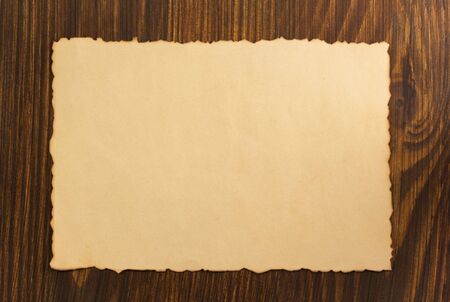 paper parchment on wooden backgroundの写真素材