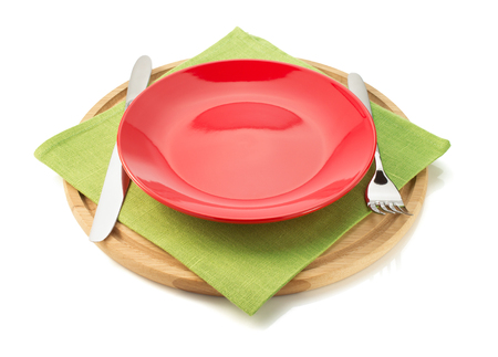 plate and fork with knife at napkin cloth on white backgroundの写真素材